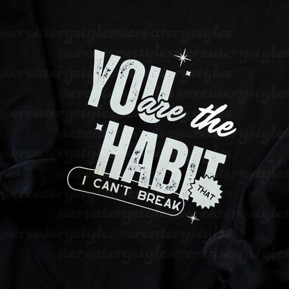 Black hoodie with white text 'You are the habit I can't break' on a black background